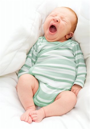 Yawning New Born Baby in the Bed Stock Photo - Budget Royalty-Free & Subscription, Code: 400-06394334