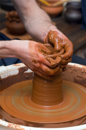 Close-up of hands making pottery on a wheel Stock Photo - Budget Royalty-Free & Subscription, Code: 400-06394890