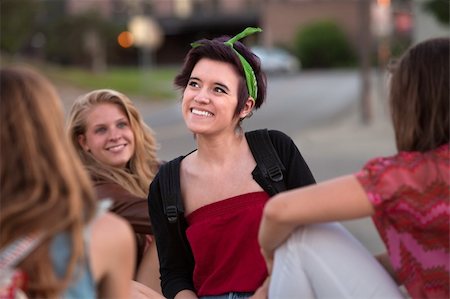 simsearch:400-04099373,k - Happy Hispanic teenage girl with friends looking away Stock Photo - Budget Royalty-Free & Subscription, Code: 400-06395167