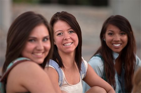 simsearch:400-04099373,k - Three pretty teenage students smiling and sitting together Stock Photo - Budget Royalty-Free & Subscription, Code: 400-06395170