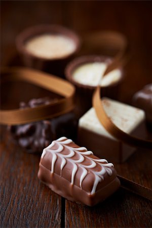 simsearch:841-06805239,k - assorted chocolates on dark wooden background Stock Photo - Budget Royalty-Free & Subscription, Code: 400-06395752