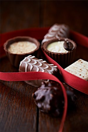 simsearch:841-06805239,k - assorted pralines on dark wooden background Stock Photo - Budget Royalty-Free & Subscription, Code: 400-06395753