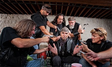 Group of bikers in leather hold up sitting man Stock Photo - Budget Royalty-Free & Subscription, Code: 400-06396536