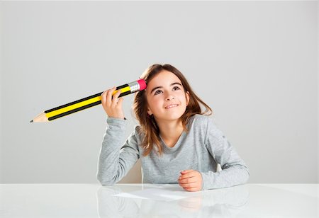 pencil painting pictures images kids - Beautiful little girl in a desk playing with a big pencil, against a gray background Stock Photo - Budget Royalty-Free & Subscription, Code: 400-06391564