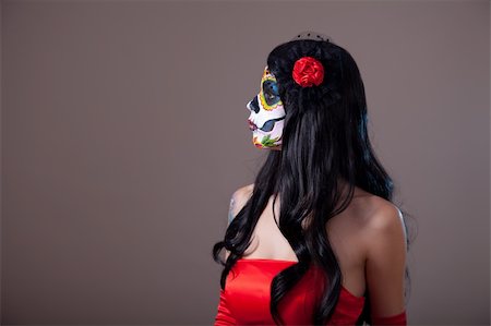Profile view of Sugar skull girl in red dress, copy-space for your text Stock Photo - Budget Royalty-Free & Subscription, Code: 400-06391700