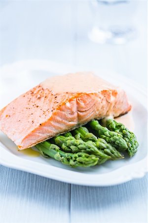 salmon fillet with cream sauce on green asparagus Stock Photo - Budget Royalty-Free & Subscription, Code: 400-06392126