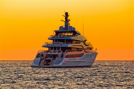 simsearch:400-07748817,k - Luxury yacht on open sea at golden sunset Stock Photo - Budget Royalty-Free & Subscription, Code: 400-06392332