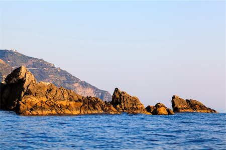 Cliffs and Rocks at Sunset in Cinque Terre, Italy Stock Photo - Budget Royalty-Free & Subscription, Code: 400-06392953