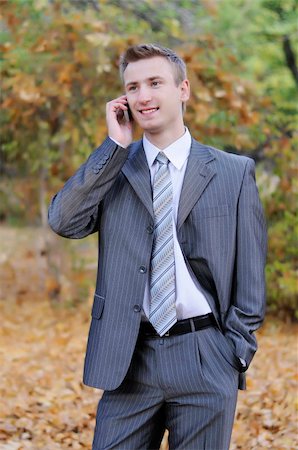 simsearch:859-06710917,k - businessman talks on the phone  in the autumn park Stock Photo - Budget Royalty-Free & Subscription, Code: 400-06393728