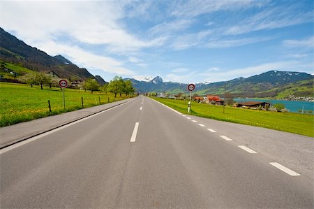 Straight Road along the Lake in the Swiss Alps Stock Photo - Budget Royalty-Free & Subscription, Code: 400-06415575