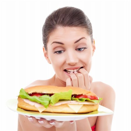 dreaming about eating - pretty woman wondering whether or not to eat a sandwich Stock Photo - Budget Royalty-Free & Subscription, Code: 400-06419130