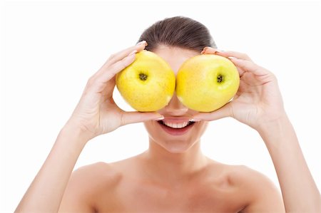 Closeup of gorgeous young woman holding apples over her eyes Stock Photo - Budget Royalty-Free & Subscription, Code: 400-06419149