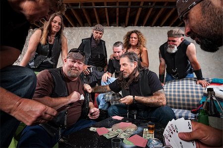 simsearch:400-06396543,k - Rowdy biker gang gambling and pulling out weapons Stock Photo - Budget Royalty-Free & Subscription, Code: 400-06424144