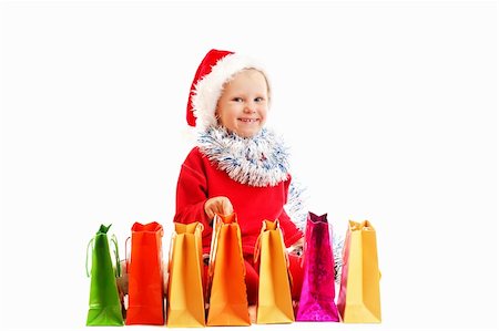 child  in red cap with Christmas presents Stock Photo - Budget Royalty-Free & Subscription, Code: 400-06426750