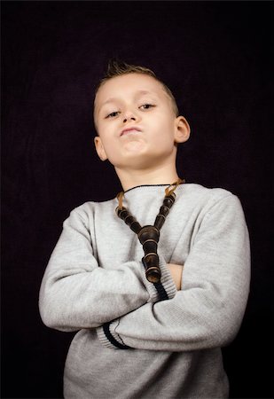 sulky tantrum - Studio shoot of a little boy with a bad attitude Stock Photo - Budget Royalty-Free & Subscription, Code: 400-06427582
