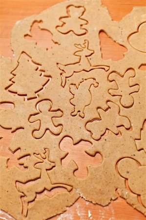 simsearch:400-05721521,k - Gingerbread cookie dough with christmas themed shape cutouts Stock Photo - Budget Royalty-Free & Subscription, Code: 400-06427835