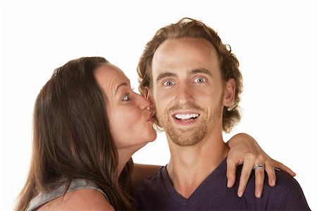 simsearch:400-06396543,k - Excited young man embraced and kissed by woman Stock Photo - Budget Royalty-Free & Subscription, Code: 400-06428047