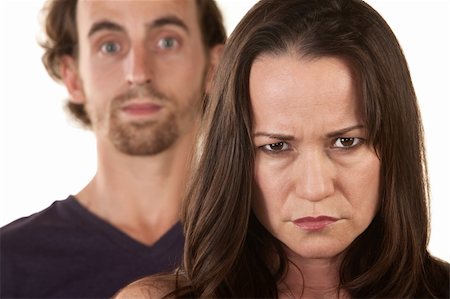 simsearch:400-06396543,k - Angry Caucasian woman frowning with man behind her Stock Photo - Budget Royalty-Free & Subscription, Code: 400-06428059