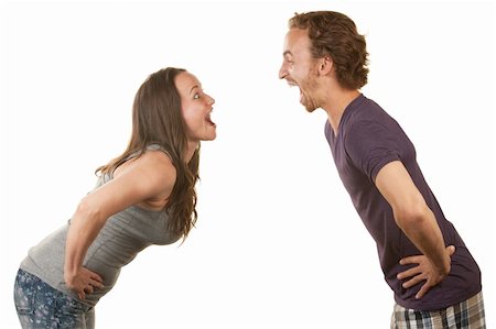 simsearch:400-06396543,k - Excited white couple with hands on hips facing each other Stock Photo - Budget Royalty-Free & Subscription, Code: 400-06428052