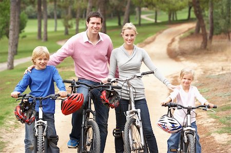 simsearch:400-06412547,k - Family enjoying bike ride in park Stock Photo - Budget Royalty-Free & Subscription, Code: 400-06420413