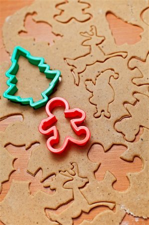 simsearch:400-05721521,k - Cutting the gingerbread cookie dough to christmas themed shapes Stock Photo - Budget Royalty-Free & Subscription, Code: 400-06430111