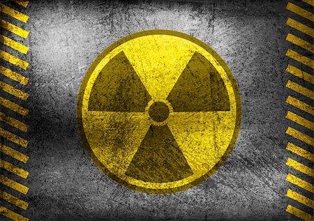 Nuclear radiation symbol on grunge wall. Vector background Stock Photo - Budget Royalty-Free & Subscription, Code: 400-06457712