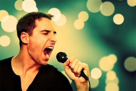 popular music concert - Retro image of man singing into microphone Stock Photo - Budget Royalty-Free & Subscription, Code: 400-06459103