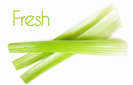 Fresh green stems of celery over white background Stock Photo - Budget Royalty-Free & Subscription, Code: 400-06463089