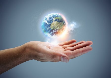 Your World -  The planet earth hovering in a hand. Stock Photo - Budget Royalty-Free & Subscription, Code: 400-06471967