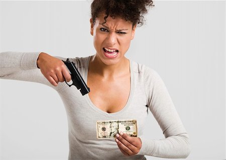 African woman shooting a US-Dollar banknote, great concept for the global crises Photographie de stock - Aubaine LD & Abonnement, Code: 400-06481623