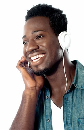 Young man with headphones enjoying music Stock Photo - Budget Royalty-Free & Subscription, Code: 400-06482599
