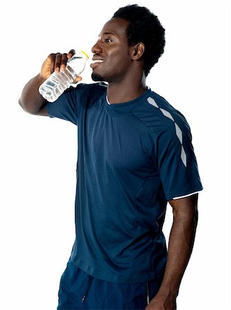 simsearch:400-06482604,k - Tired african athlete drinking water against white background Stock Photo - Budget Royalty-Free & Subscription, Code: 400-06482605