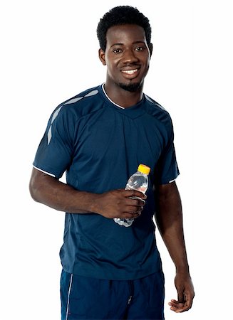 simsearch:400-06482604,k - Handsome man holding water bottle isolated over white background Stock Photo - Budget Royalty-Free & Subscription, Code: 400-06482603
