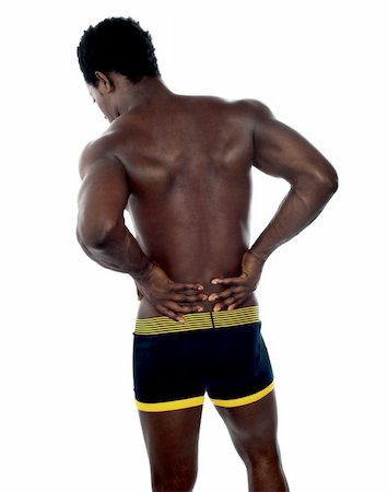 simsearch:400-06859193,k - Back pose of young fit male trainer. Hands on his waist Stock Photo - Budget Royalty-Free & Subscription, Code: 400-06482612