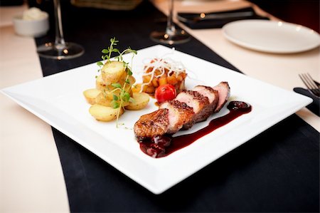 Roasted duck with pear,marinated in red wine and mascarpone rose Stock Photo - Budget Royalty-Free & Subscription, Code: 400-06518393