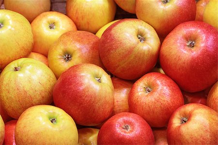 Closeup of many red-yellow juicy apple fruits in market Stock Photo - Budget Royalty-Free & Subscription, Code: 400-06524729