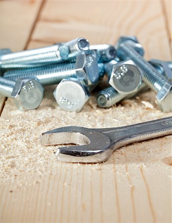simsearch:400-05240852,k - Screws pile and key on wooden surface - closeup Stock Photo - Budget Royalty-Free & Subscription, Code: 400-06526967