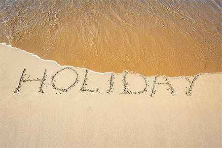 summer text message - An image of a word in the sand: HOLIDAY Foto de stock - Super Valor sin royalties y Suscripción, Código: 400-06527330