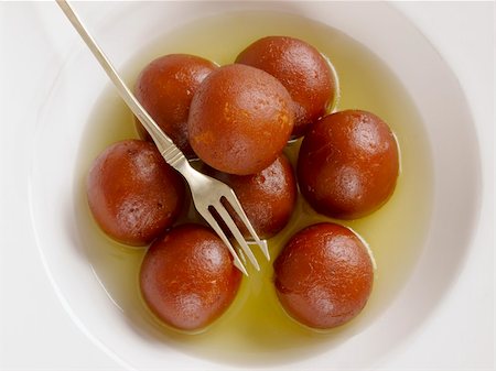 close up of indian dessert gulab jamun Foto de stock - Super Valor sin royalties y Suscripción, Código: 400-06521645