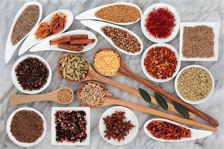 Large herb and spice selection in white bowls and wooden spoons over marble background. Stock Photo - Budget Royalty-Free & Subscription, Code: 400-06522469