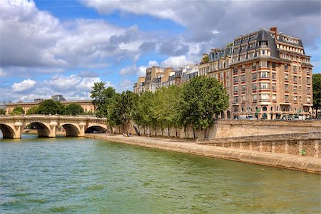 famous photographs of paris bridge - Urban view on bridge and promenade along Seine river and typical parisian building facade in Paris, France. Stock Photo - Budget Royalty-Free & Subscription, Code: 400-06523022