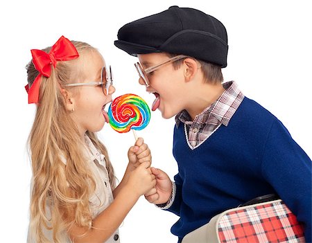 Kids wearing funny sunglasses sharing a large lollipop - isolated Stock Photo - Budget Royalty-Free & Subscription, Code: 400-06555940