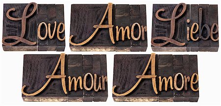 love word in 5 languages (English, Spanish, German, French and Italian) - a collage of isolated text in vintage letterpress wood type printing blocks, script font Stock Photo - Budget Royalty-Free & Subscription, Code: 400-06556123