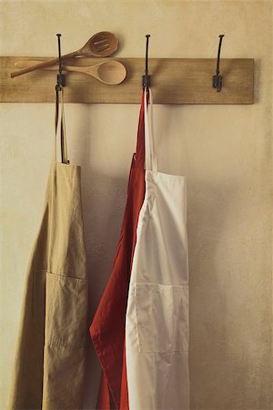 Kitchen aprons hanging on hooks with vintage feel Stock Photo - Budget Royalty-Free & Subscription, Code: 400-06558231