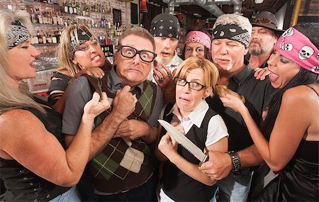 simsearch:400-06396523,k - Biker gang mugging scared nerd couple in bar Stock Photo - Budget Royalty-Free & Subscription, Code: 400-06558605