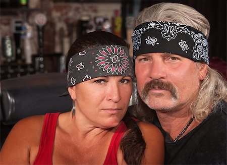 simsearch:400-06396543,k - Serious middle aged couple in bandannas at a bar Stock Photo - Budget Royalty-Free & Subscription, Code: 400-06558625