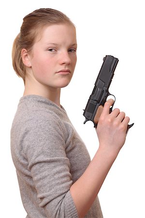 Portrait of a young teenage girl with a gun on white background Foto de stock - Super Valor sin royalties y Suscripción, Código: 400-06568185