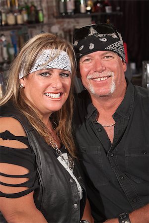 simsearch:400-06396543,k - Handsome middle aged couple in leather and bandanna in bar Stock Photo - Budget Royalty-Free & Subscription, Code: 400-06561352