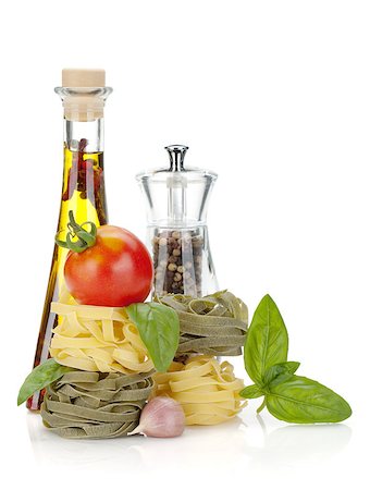 simsearch:400-06796273,k - Italian food: pasta, tomatoes, olive oil, pepper. Isolated on white background Stock Photo - Budget Royalty-Free & Subscription, Code: 400-06562422