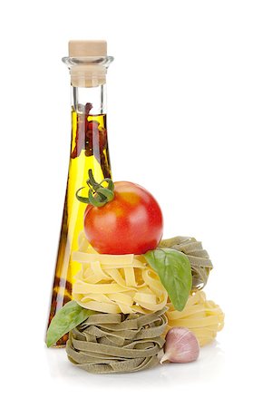 simsearch:400-06796273,k - Italian food: pasta, tomatoes, olive oil. Isolated on white background Stock Photo - Budget Royalty-Free & Subscription, Code: 400-06562423